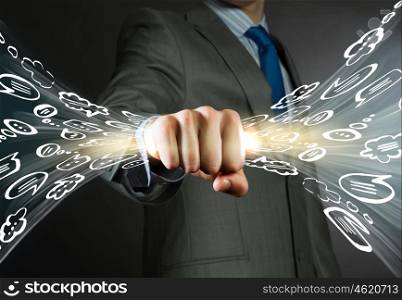 Business dialogues. Close up of businessman grasping light in fist