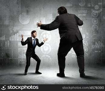 Business dispute. Image of businesspeople arguing and acting as sumo fighters
