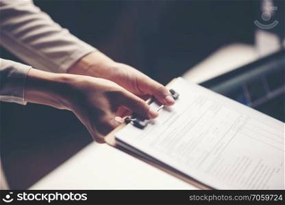 business document in hand of businessman
