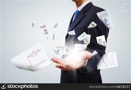 Business documentation. Close up of businessman with papers in hands