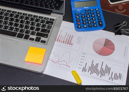 Business documents, computers and graph