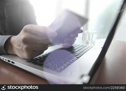 business documents on office table with digital tablet and laptop computer with overcast exposure