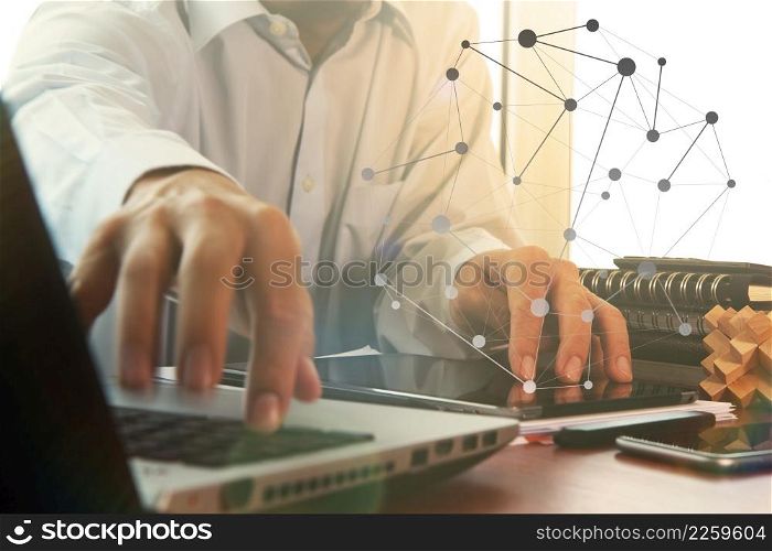business documents on office table with digital tablet and man working with smart laptop computer background with overcast exposure effect with social media diagram