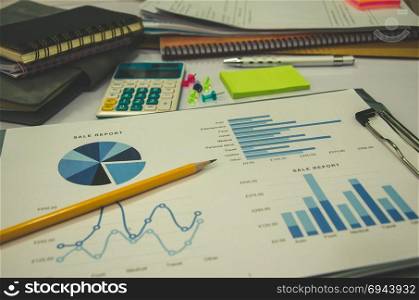 business documents on office table with graph financial.