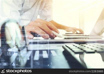 business documents on office table with laptop computer and graph business digital diagram and businessman working in the background