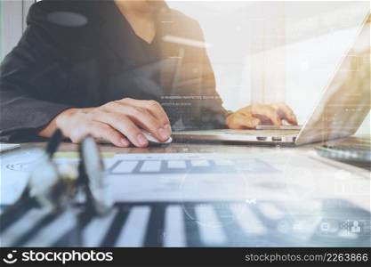 business documents on office table with laptop computer and smart phone and graph business digital diagram and businessman working in the background