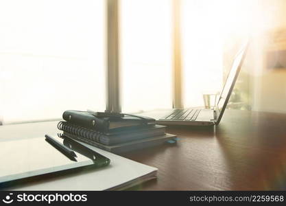 business documents on office table with pen and digital tablet as work space business concept with overcast exposure effect