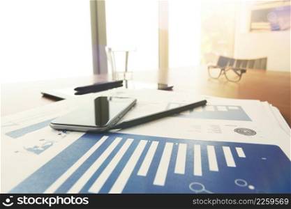 business documents on office table with pen and digital tablet as work space business concept with overcast exposure effect