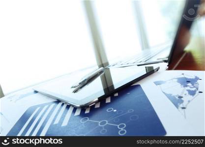 business documents on office table with pen and digital tablet as work space business concept
