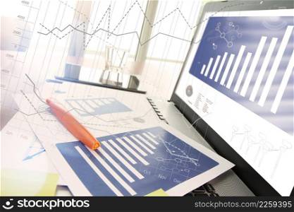 business documents on office table with smart phone and digital tablet and modern pen with laptop computer in workspace concept