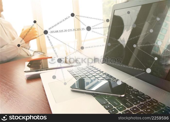 business documents on office table with smart phone and digital tablet and graph business diagram and man holding a cup of coffee in the background