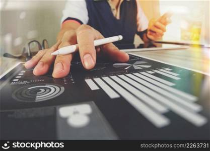 business documents on office table with smart phone and digital tablet and graph business with social network diagram and man working in the background