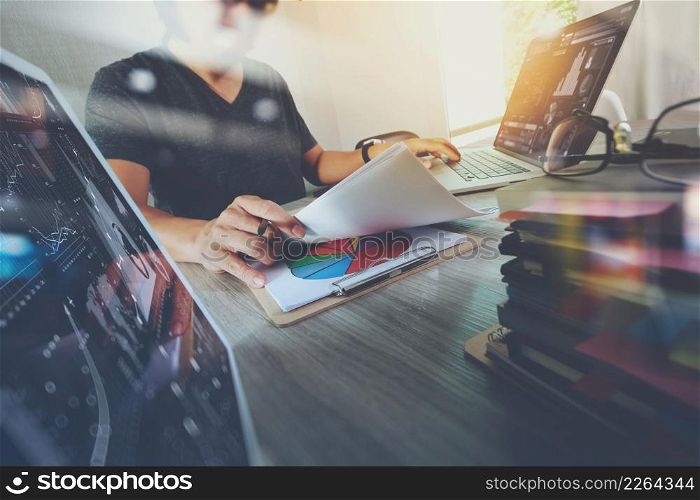 business documents on office table with smart phone and digital tablet and graph business with stack book and man working in the background