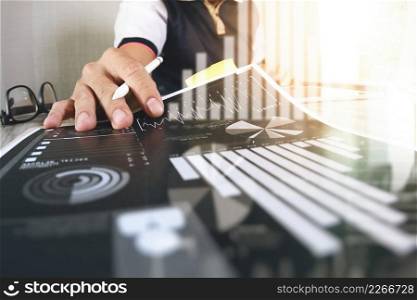 business documents on office table with smart phone and digital tablet and graph business with social network diagram and man working in the background  