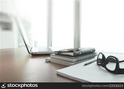 business documents on office table with smart phone and digital tablet as work space business concept