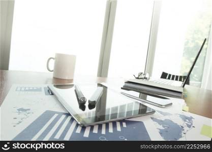 business documents on office table with smart phone and stylus pen and digital tablet and laptop computer with social network diagram concept