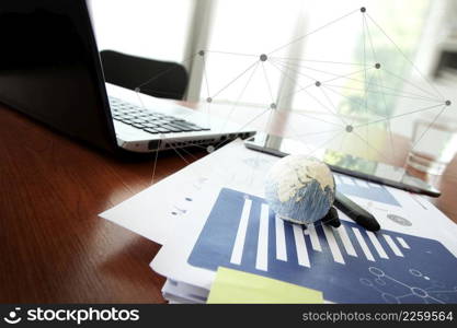 business documents on office table with texture the world on smart phone and digital tablet as work space business concept Elements of this image furnished by NASA