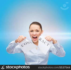 business, documents, people, legal and real estate concept - serious businesswoman tearing contract