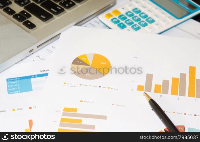 business documents with charts growth, keyboard and pen. workplace businessman