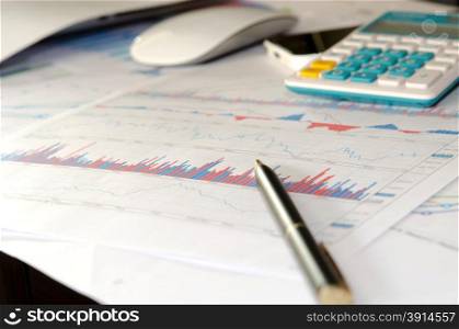 business documents with charts growth, mouse and pen. workplace businessman