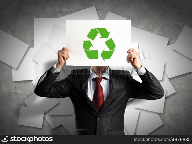 Business ecology. Image of man holding board with recycling sign