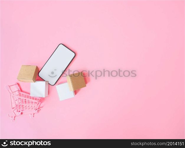 Business ecommerce and online shopping concepts from smartphone with blank screen and product box order on pink background. Top view
