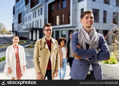 business, education and corporate concept - international group of people on city street. international group of people on city street