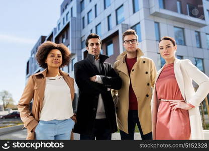 business, education and corporate concept - international group of people on city street. international group of people on city street