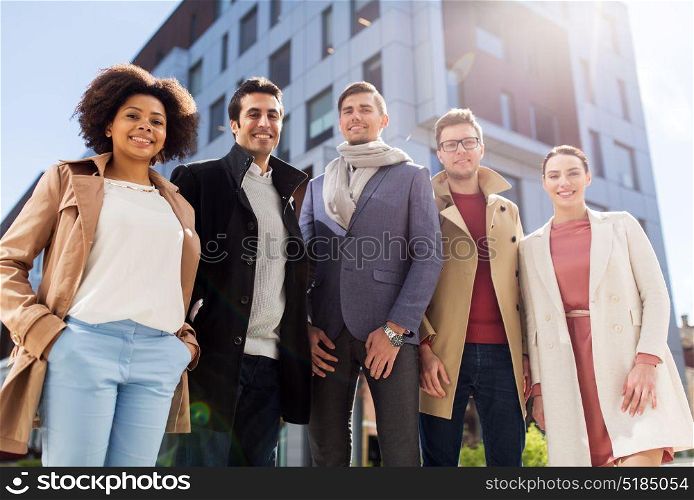 business, education and corporate concept - international group of people on city street. international group of people on city street