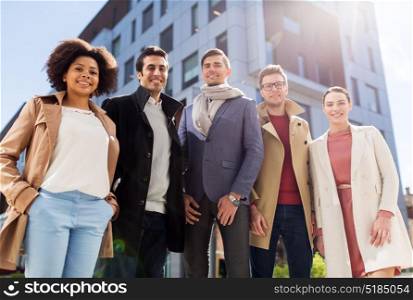 business, education and corporate concept - international group of people on city street. international group of people on city street