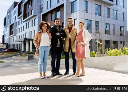 business, education and corporate concept - international group of people or friends on city street. international group of people on city street