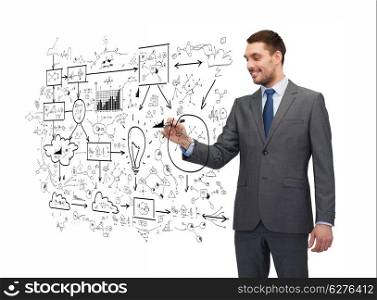 business, education and office concept - attractive buisnessman or teacher with marker writing or drawing something