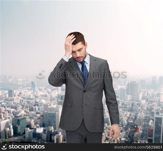business, education and office concept - handsome businessman having headache over forex chart background over cityscape background