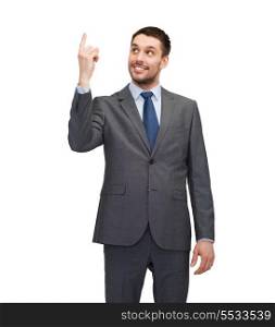 business, education and office concept - smiling businessman with finger up