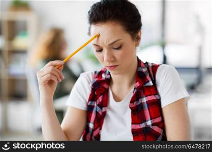 business, education and people concept - close up of creative woman or student with pencil thinking at office. creative woman with pencil thinking at office. creative woman with pencil thinking at office