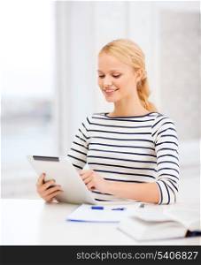 business, education and technology concept - smiling student with book, tablet pc computer and notebook in college