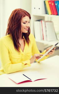 business, education and technology concept - smiling student with tablet pc computer and notebook in college