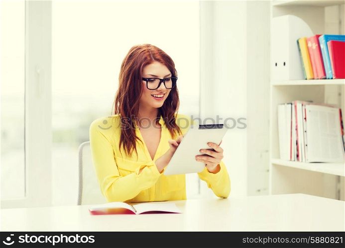 business, education and technology concept - smiling student with tablet pc computer and notebook in college