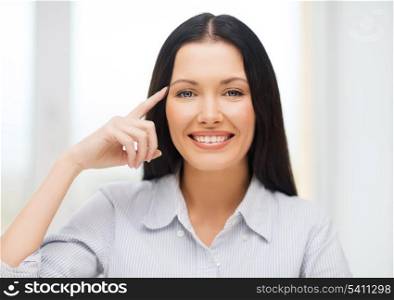 business, education and technology concept - smiling woman pointing to imaginary glasses