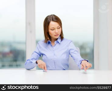 business, education and technology concept - smiling woman pointing to something or pressing imaginary button