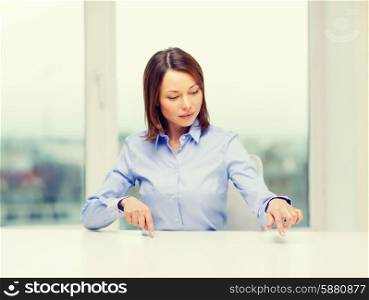 business, education and technology concept - smiling woman pointing to something or pressing imaginary button