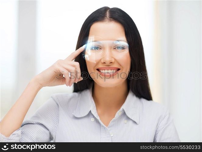 business, education and technology concept - smiling woman pointing to virtual futuristic glasses