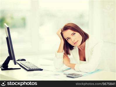 business, education and technology concept - stressed businesswoman with computer, papers and calculator in office