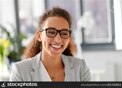 business, education and vision concept - portrait of african american woman in glasses at office. portrait of african american woman in glasses. portrait of african american woman in glasses