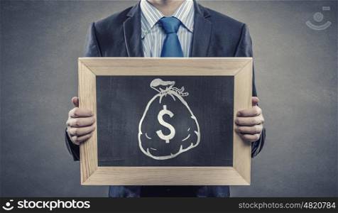 Business education. Close up of businessman holding chalkboard with business ideas