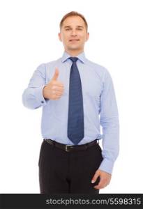 business, education, gesture and office concept - smiling businessman showing thumbs up