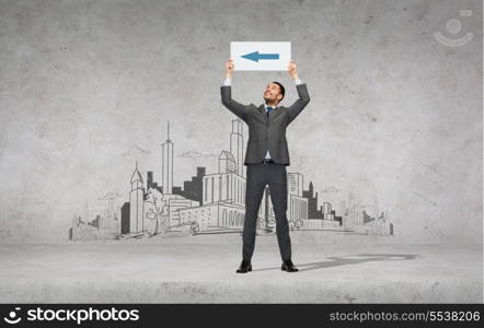 business, education, office and advertising concept - smiling businessman with arrow on small white board
