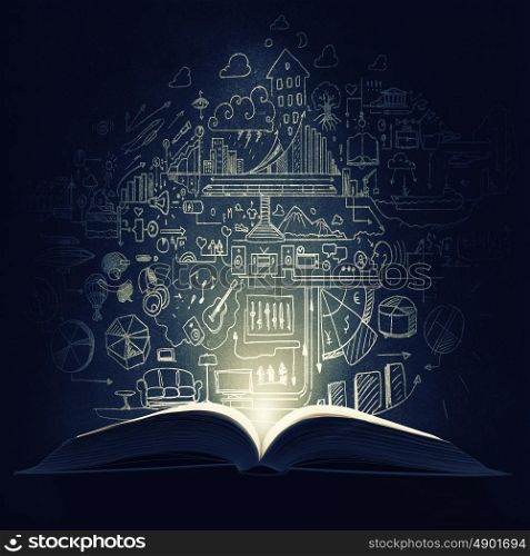 Business education. Old opened book with business sketches over black background