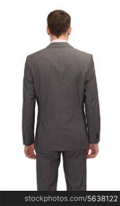 business, education, people and office concept - businessman or teacher in suit from back