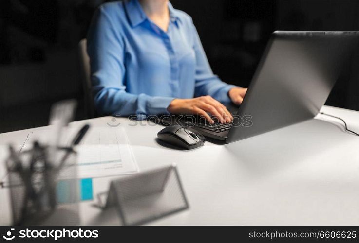 business, education, people and technology concept - close up of female hands with laptop and computer mouse on table. close up of female hands with laptop and mouse